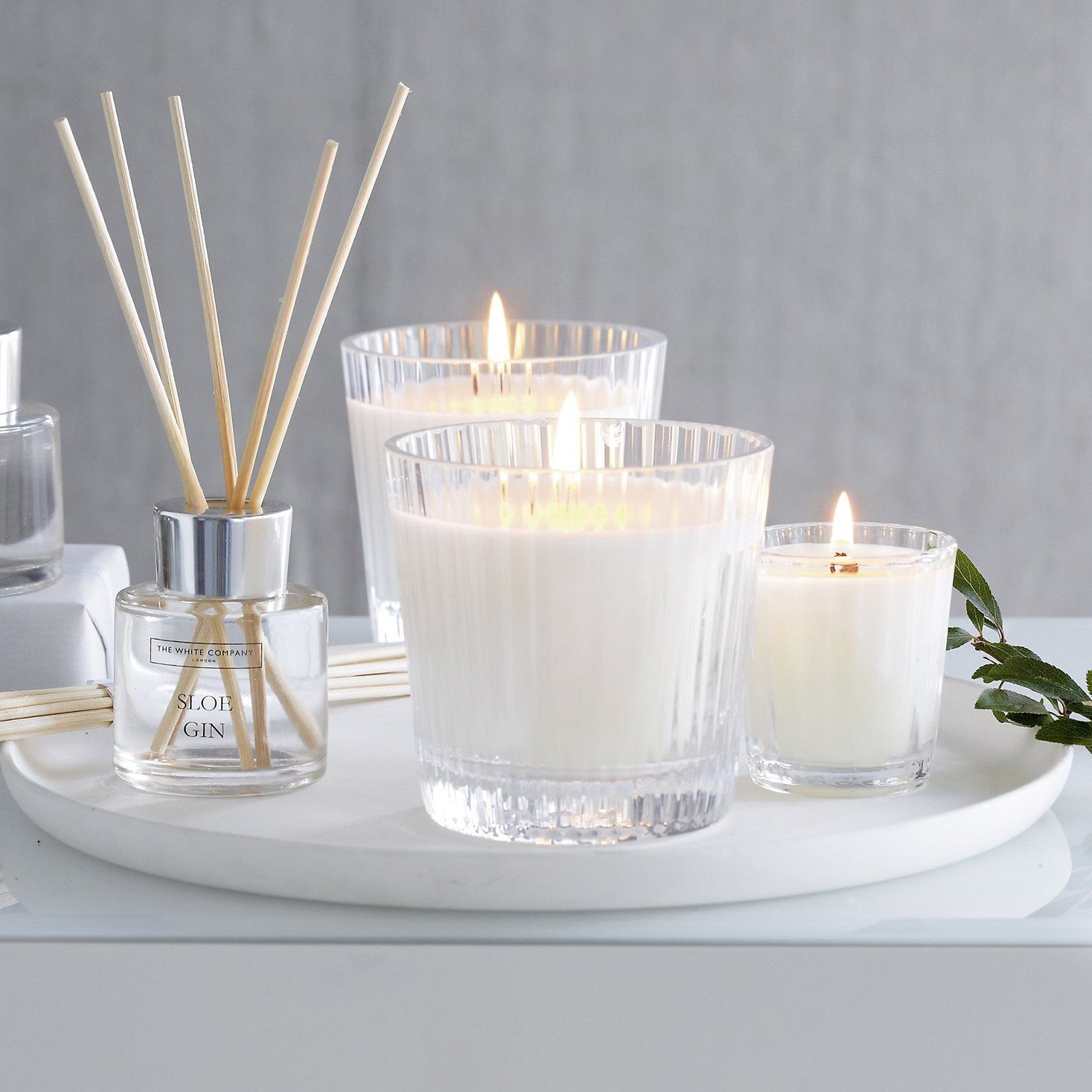 Elegant candles and diffusers creating a soothing ambiance with warm light and delightful fragrances.